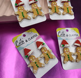 Gingerbread Men that swing from Santa hats. Red
