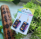 Mix cassette tape dangles. Gold and pink