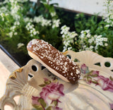 Chocolate Iced Finger Bun with Coconut Flakes Hair Clip