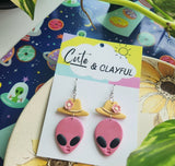 Alien Cowboy dangles. Pink alien with pink flower