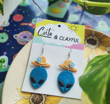 Alien Cowboy dangles. Blue Alien with blue flower
