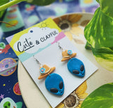Alien Cowboy dangles. Blue Alien with blue flower
