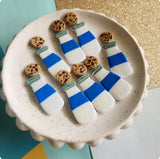 Milk bottle dangles with cookies