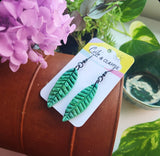 Leaf hook dangles with resin raindrops