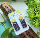 Mix cassette tape dangles. Yellow glittery stud tops