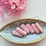 Strawberry Pink Iced Finger Bun with Coconut flakes