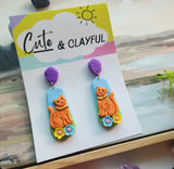 Orange Kitties with purple stud tops
