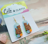 Brown kitties with hooks and blue and peach flower