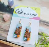 Brown kitties with hooks and blue and peach flower