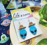 Alien Cowboy dangles. Blue Alien with brown hats