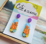 Orange Kitties with purple stud tops