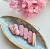Strawberry Pink Iced Finger Bun with Coconut flakes