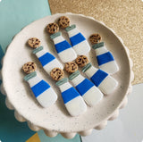 Milk bottle dangles with cookies