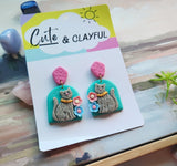 Grey Kitties with pink stud tops. Arch