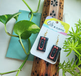 Mix tape cassette dangles. Grey and orangey red