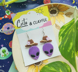 Alien Cowboy dangles. Purple alien with purple flower