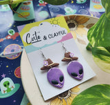 Alien Cowboy dangles. Purple alien with purple flower