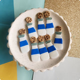 Milk bottle dangles with cookies