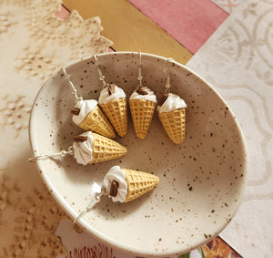 Vanilla soft serve dangles with flakes