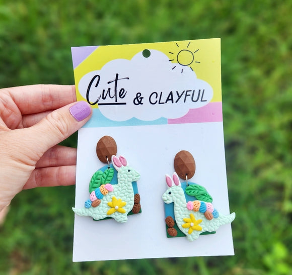 Easter Dinos with yellow flower 🌼